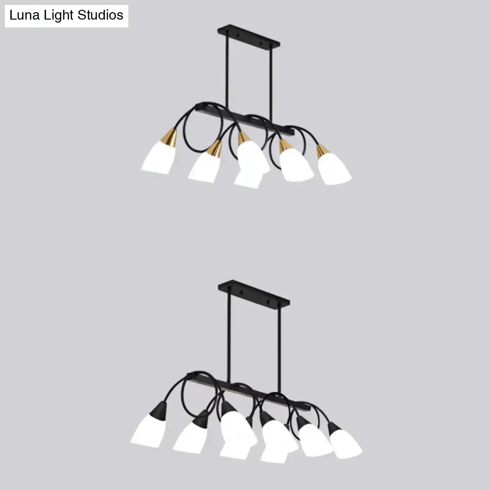Modern black and gold ceiling light with six white glass shades for dining room island by decorbites