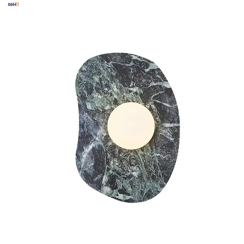 Modern black and green marble wall sconce with circular warm light featuring decorbites green marble stone design