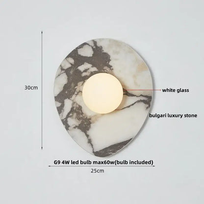 Modern black and green marble wall sconce with white glass bulb on polished decorbites green marble stone base