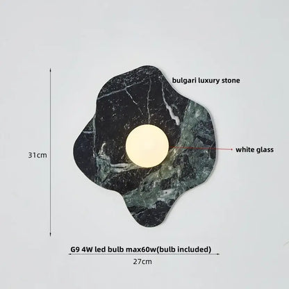 Modern black and green marble wall sconce with organic bulgari luxury stone base and white glass diffuser decorbites green marble