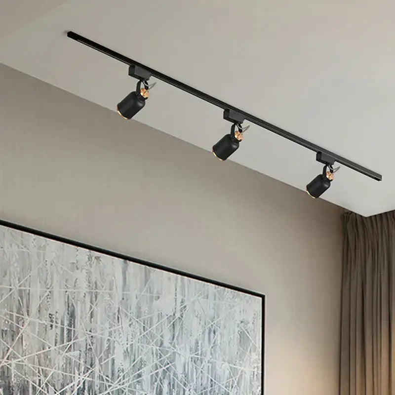 Modern black gu10 7w led track light with three adjustable spotlights on a sleek rail for kitchen display lighting