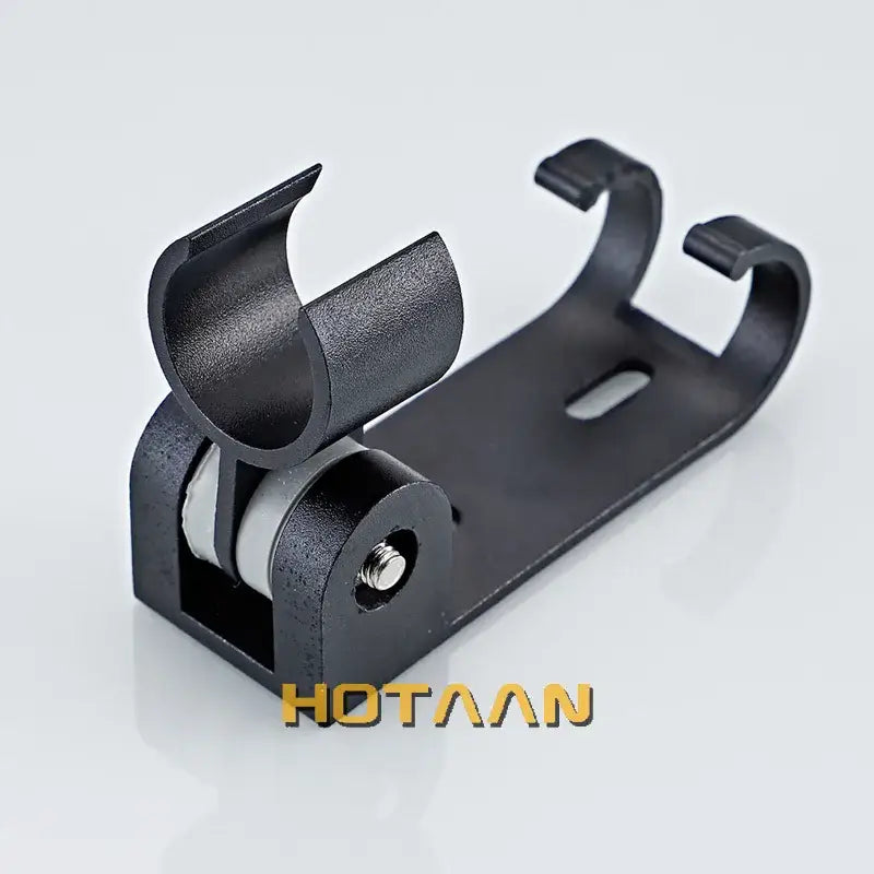 Modern black hand shower holder with hooks featuring a curved black plastic and metal wall mount bracket roller clamp