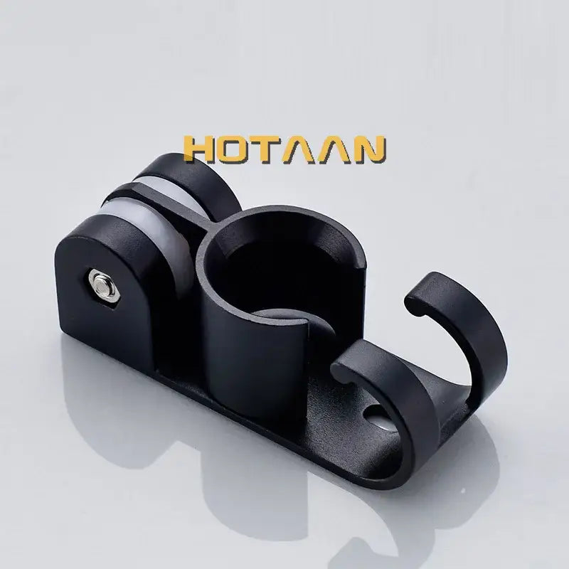 Modern black hand shower holder wall mount bracket with multi-hook organizer and central cup with silver screw detail