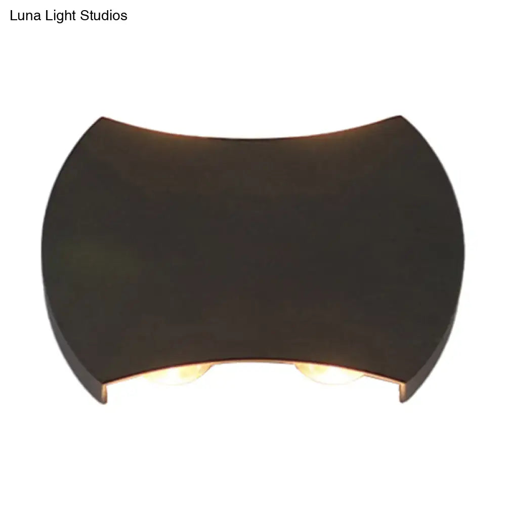 Dark bronze-finished wall washer sconce with sleek curved design and two warm lights for hallway wall lighting