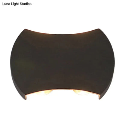 Dark bronze-finished wall washer sconce with sleek curved design and two warm lights for hallway wall lighting