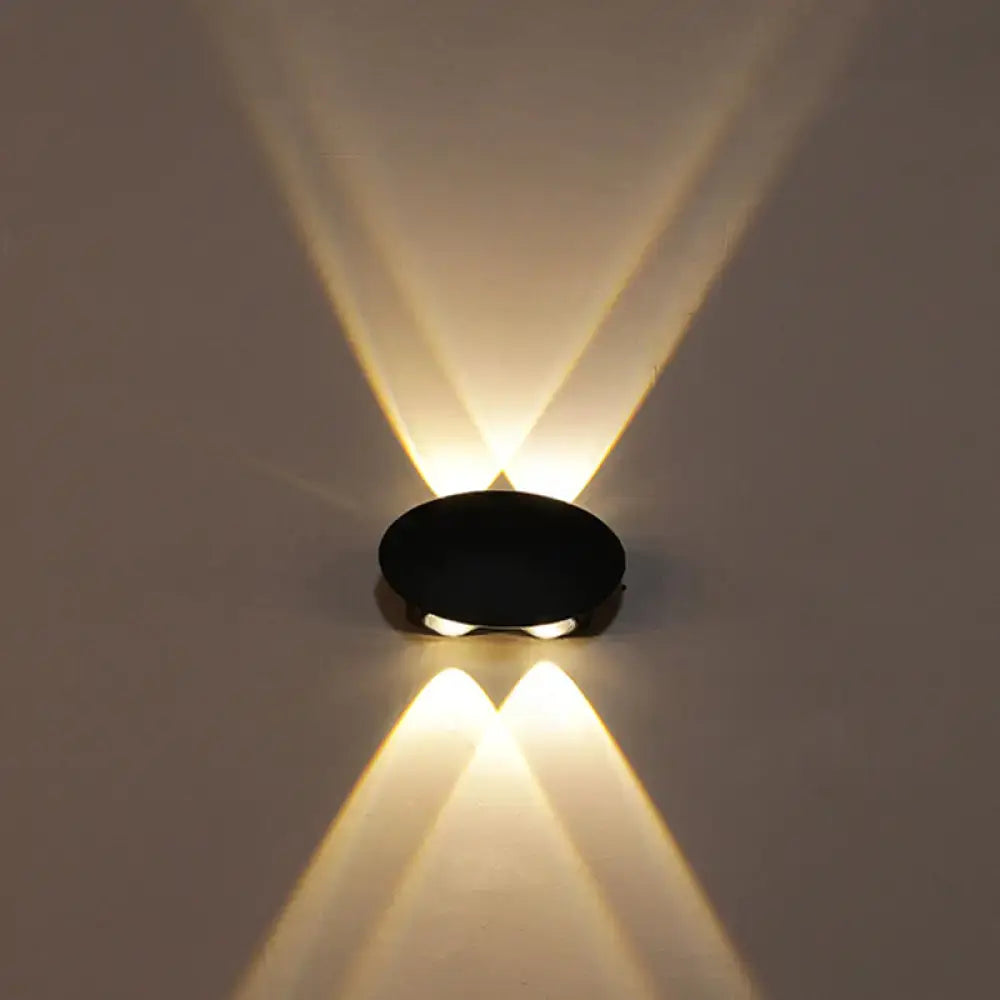 Modern black hexagonal led wall washer sconce with two warm white led lights casting symmetrical beams for hallway lighting