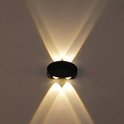 Modern black hexagonal led wall washer sconce with two warm white led lights casting symmetrical beams for hallway lighting