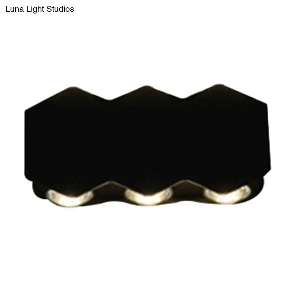 Modern black hexagonal wall washer sconce with three integrated led lights for hallway wall light illumination