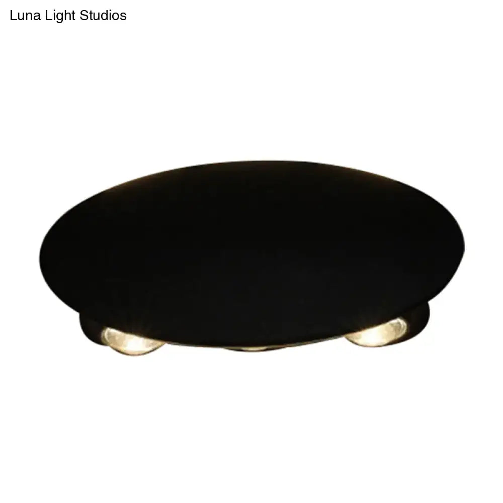 Modern black oval wall washer sconce with three warm-toned led bulbs for hallway wall light lighting