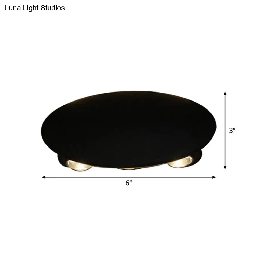 Modern black oval ceiling wall washer sconce with three recessed led bulbs for hallway lighting