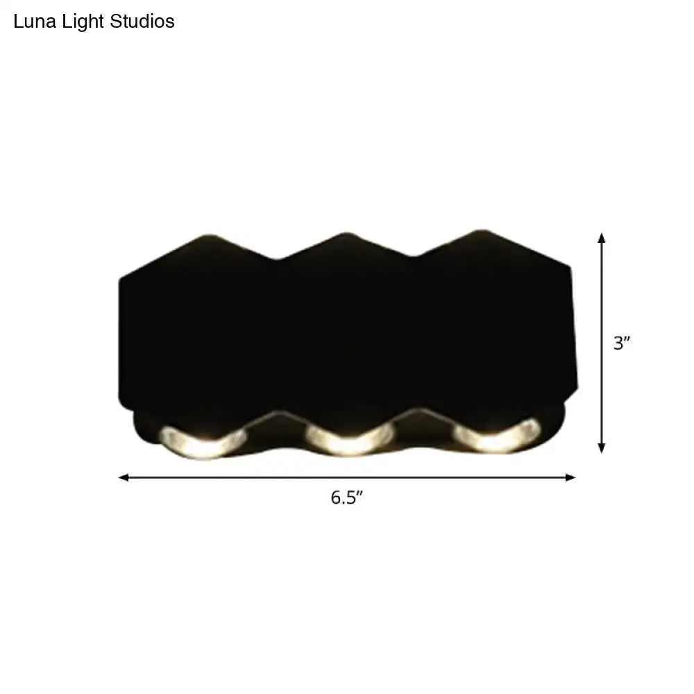 Modern black hexagonal led wall washer sconce with three integrated lights designed as a hallway wall light