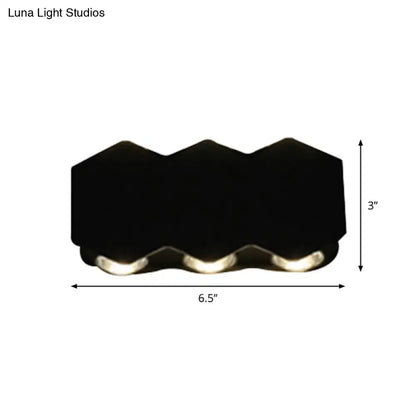 Modern black hexagonal led wall washer sconce with three integrated lights designed as a hallway wall light
