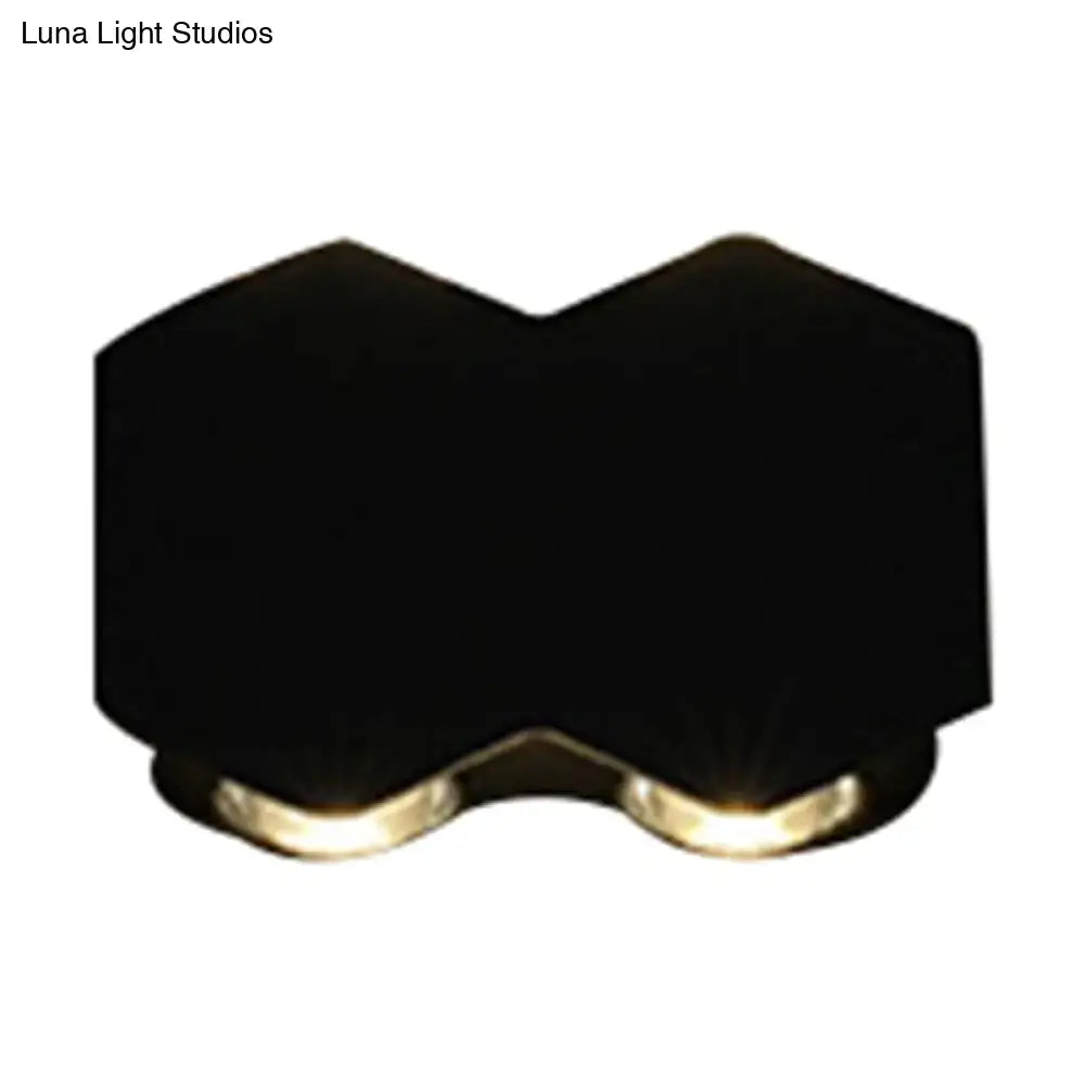 Modern black hexagonal wall washer sconce with two warm-toned led lights for hallway lighting wall light