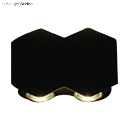 Modern black hexagonal wall washer sconce with two warm-toned led lights for hallway lighting wall light