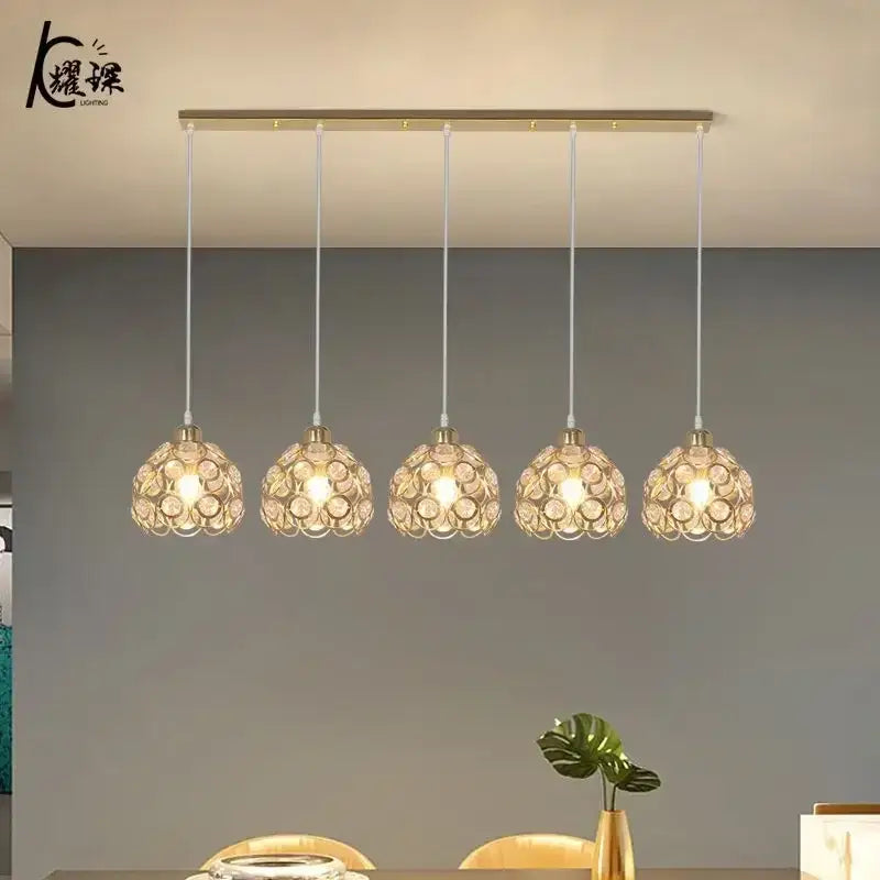 Modern black iron cage pendant lamp with gold-toned crystal dining pendant lights for kitchen island decorbites lighting