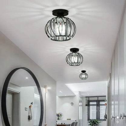 Modern black iron round crystal ceiling chandelier with black metal cage and clear glass panels for dining room decorbites iron round