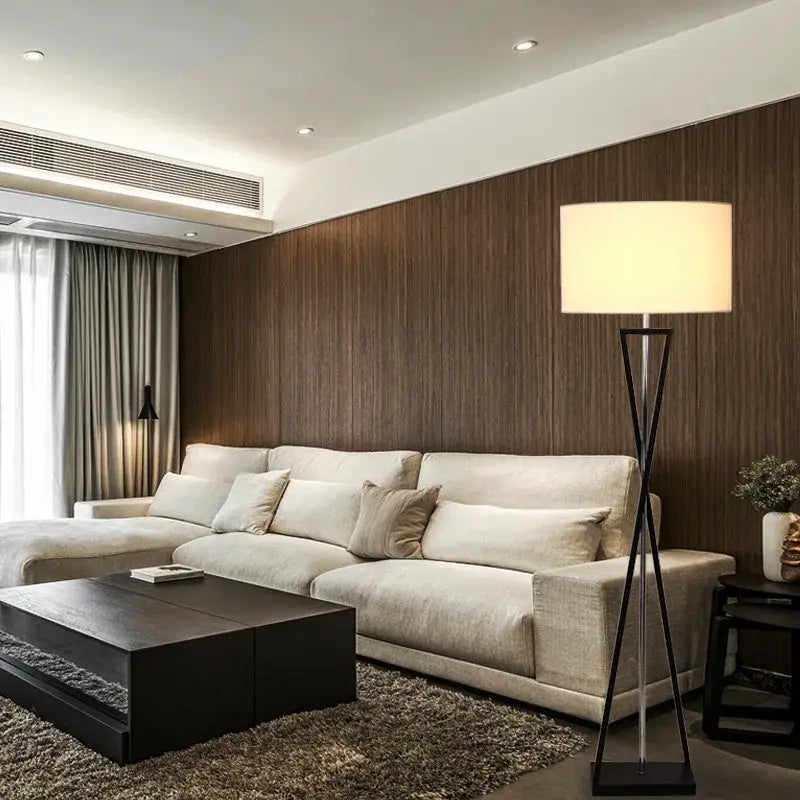 Modern black iron table lamp with fabric shade featuring a sleek tripod base ideal for bedroom decorbites iron table