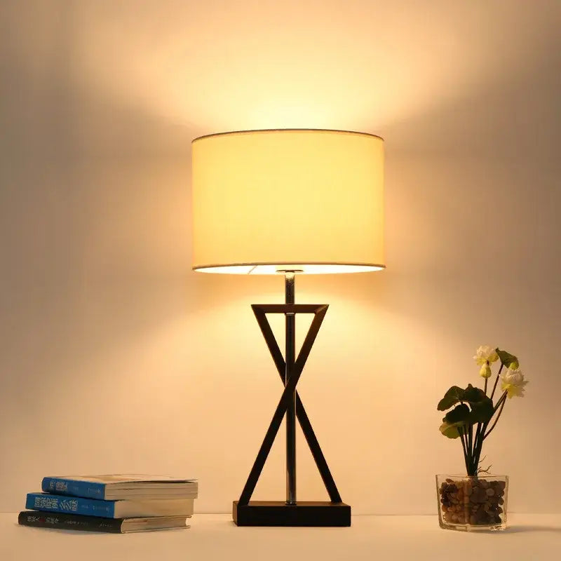 Modern black iron table lamp with cylindrical cream fabric shade ideal for bedroom decorbites iron table lamp