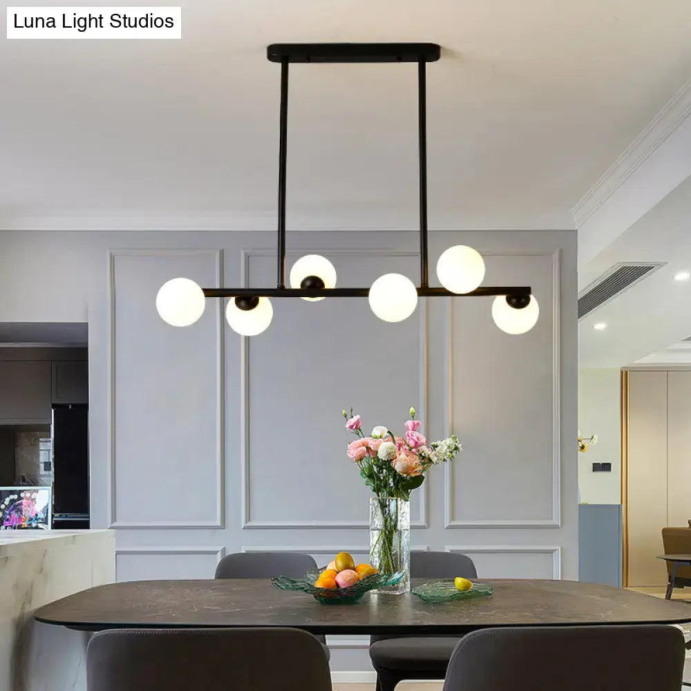Modern black metal modo island ceiling chandelier with six frosted glass globe lights for elegant dining room lighting