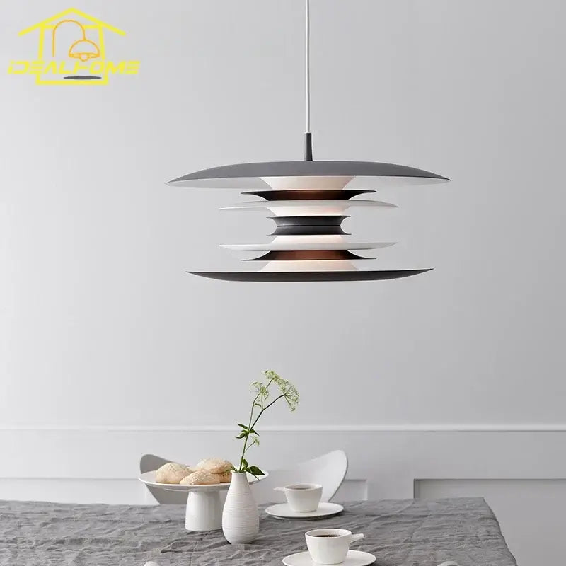Modern black layered iron art flying pendant light with matte black and white concentric rings for dining room decorbites iron art