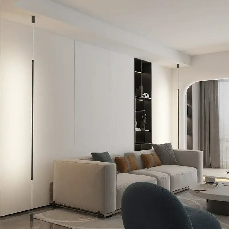Beige upholstered sectional sofa with gray and brown pillows under decorbites black modern led pendant light for dining room