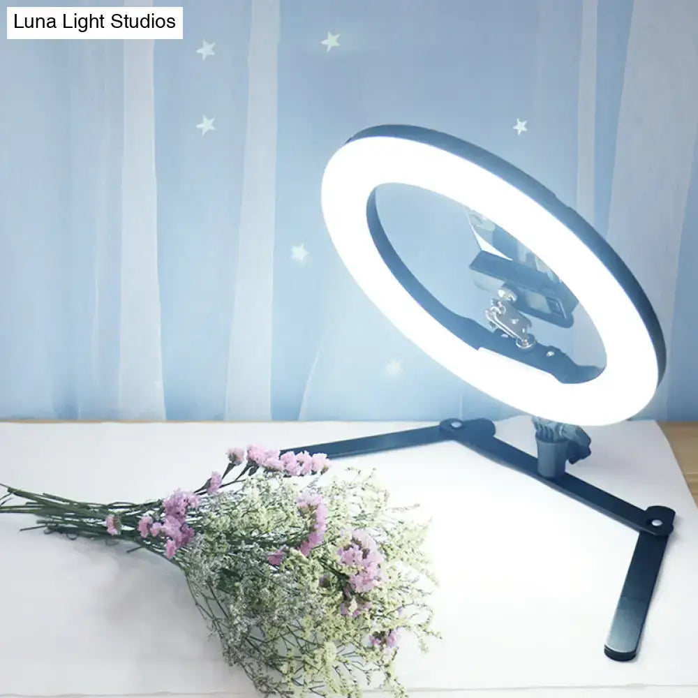Modern black led ring flash lamp with metallic shade and adjustable stand featuring bright white bulb included illumination