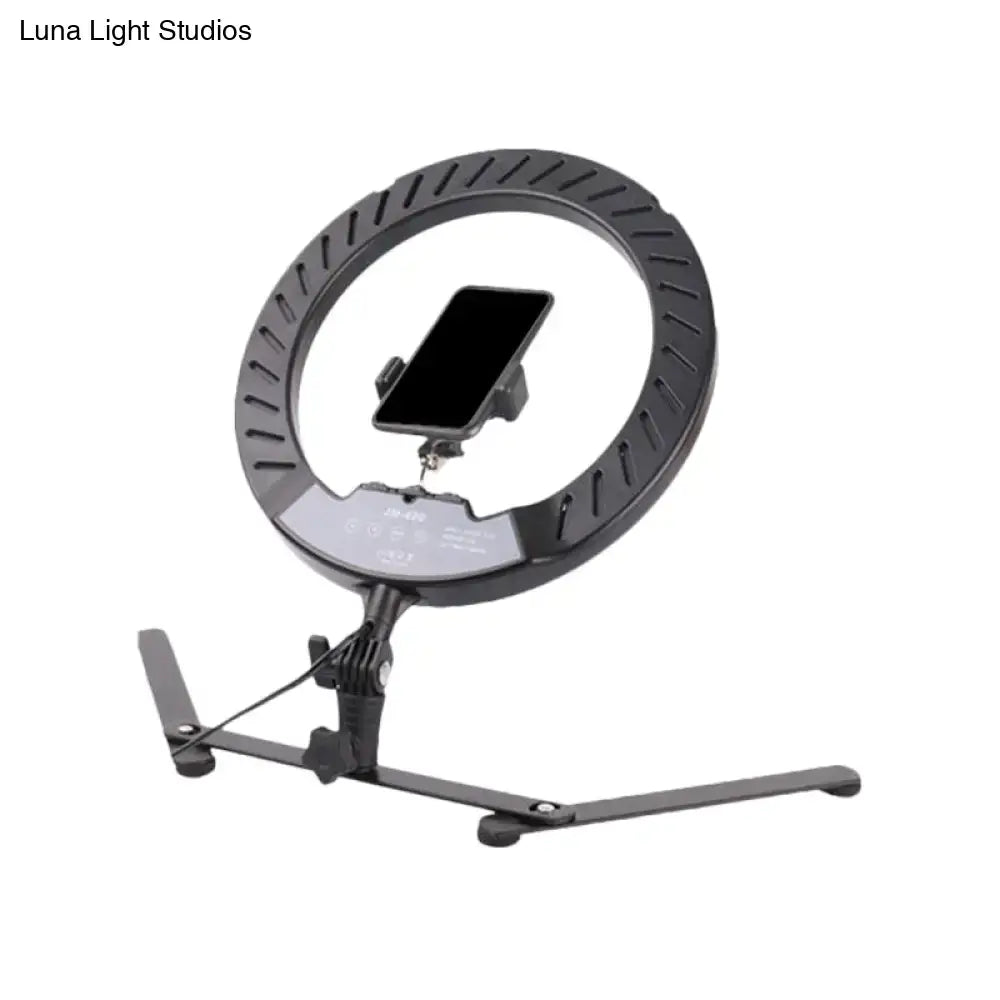 Modern black led ring flash lamp with metallic shade and bulb included featuring a phone mount on its stand