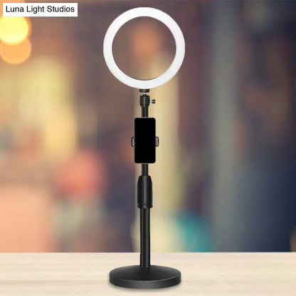 Modern black led ring flash light with adjustable stand and phone clamp designed as a bedroom lamp wall light