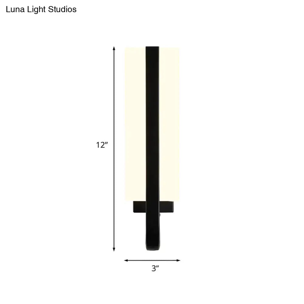 Modern black led sconce light fixture with matte black metal frame and frosted glass shade providing white warm light