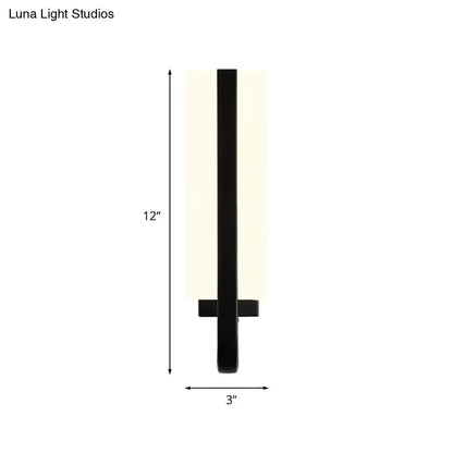 Modern black led sconce light fixture with matte black metal frame and frosted glass shade providing white warm light