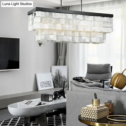 Decorbites modern rectangular island light fixture with layered translucent white glass panels and black metal frame
