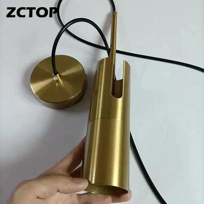 Gold finished cylindrical pendant light with black cord featuring a modern led spotlight chandelier design for living rooms