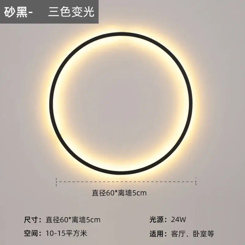 A sleek black modern led wall circle light with a glowing three-color-changing ring for living room use