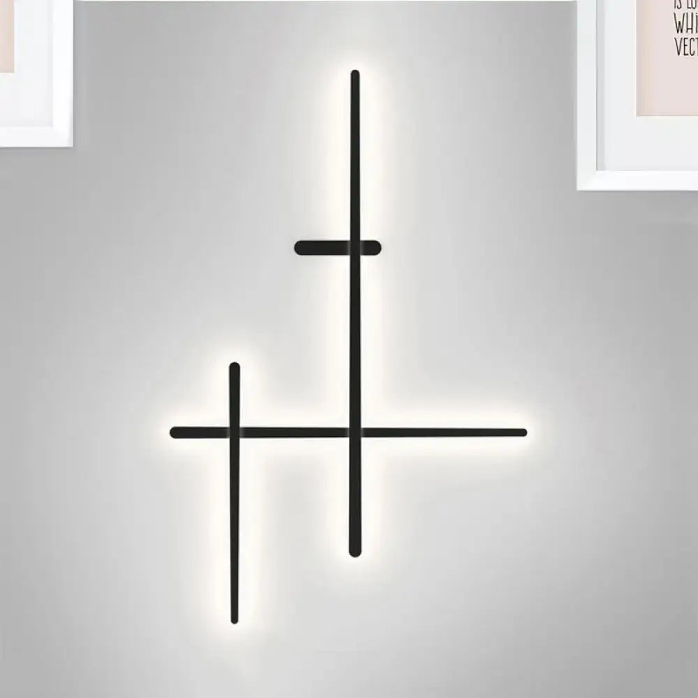 Modern black minimalist wall light with illuminated crossed lines design and bulb included for living room use