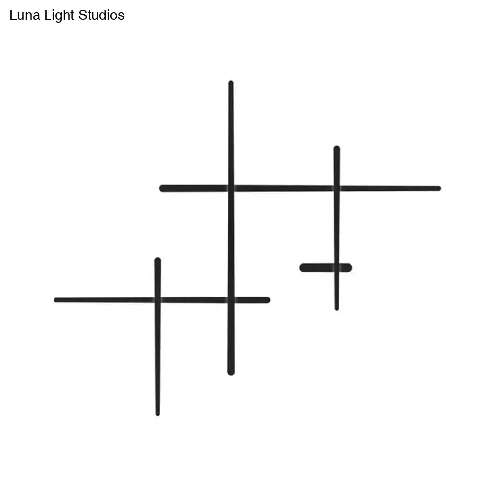 Modern black led wall light with crossed lines wall mounted cross shelf set bulb included and bulb base visible