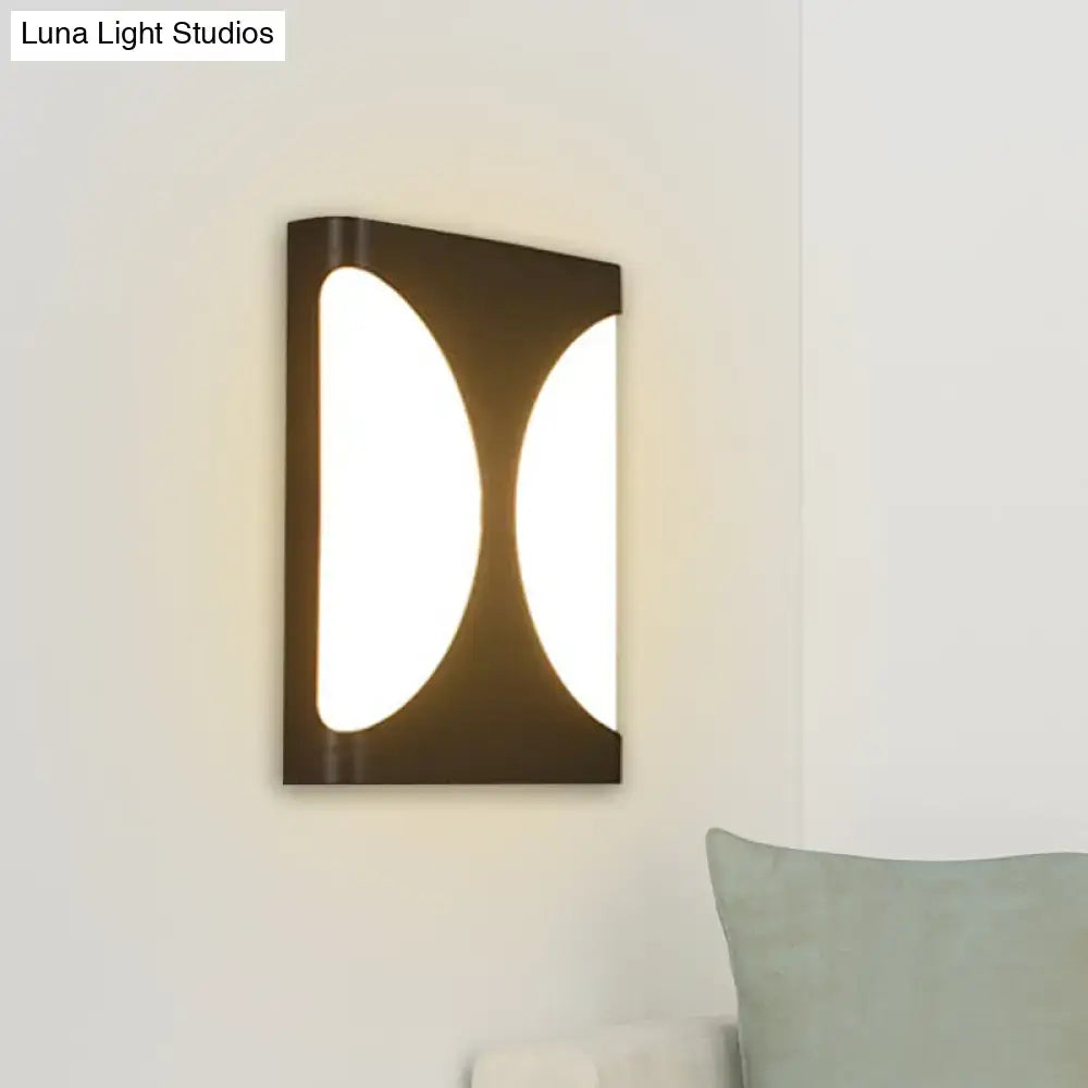 Modern black led wall sconce with double semicircle pattern featuring two illuminated oval panels for bedroom use