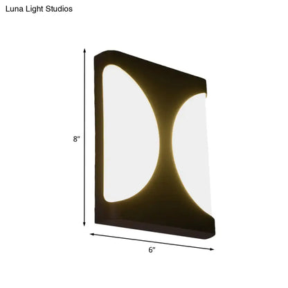 Modern black led wall sconce with sleek double semicircle pattern design providing warm ambient bedroom lighting