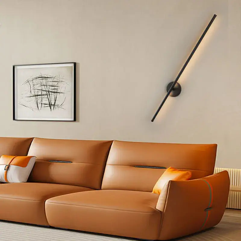 Modern black led wall sconce with sleek angled design and dimmable touch switch for bedroom lighting