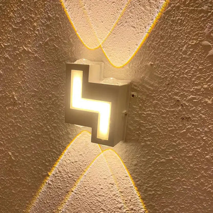 Modern black geometric wall lamp emitting warm yellow light with decorbites ip65 led waterproof design