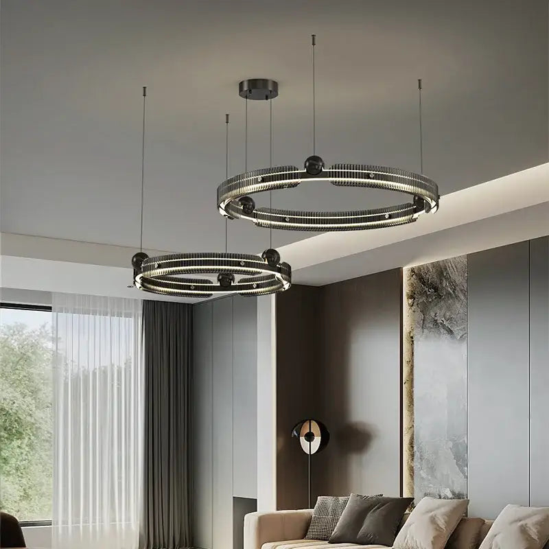 Modern black light luxury circle led chandelier pendant featuring sleek metallic rings and embedded led bulbs for living room decorbites light luxury