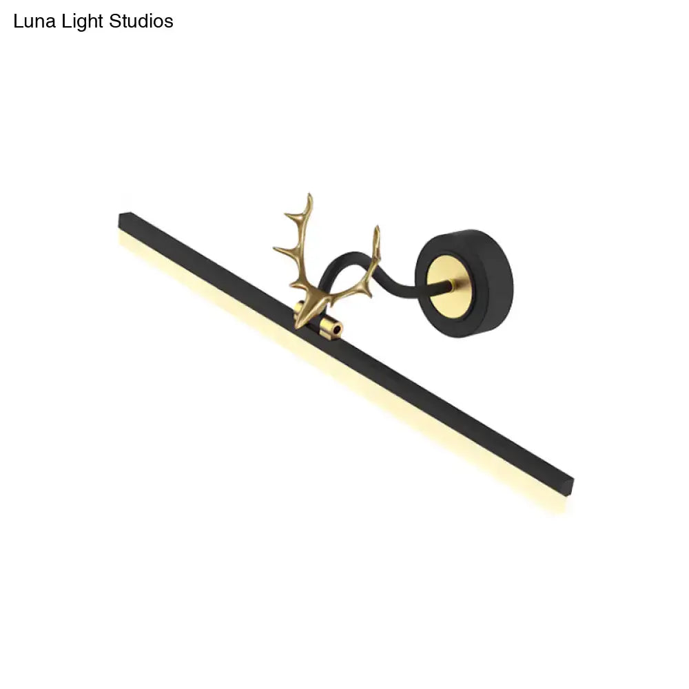 Modern black linear vanity light with warm white LED featuring gold-toned deer antler accent and circular mount