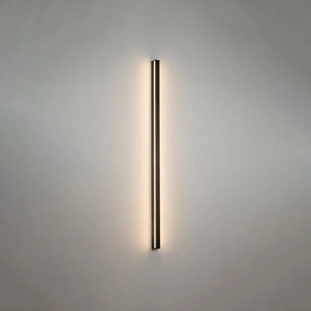 Modern black linear flush mount wall sconce with warm ambient lighting for hallway use in a minimalist rectangular design