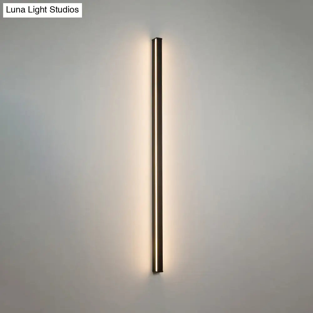 Modern black linear flush mount wall sconce with a sleek rectangular design and warm ambient lighting for hallways