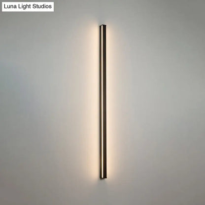 Modern black linear flush mount wall sconce with a sleek rectangular design and warm ambient lighting for hallways