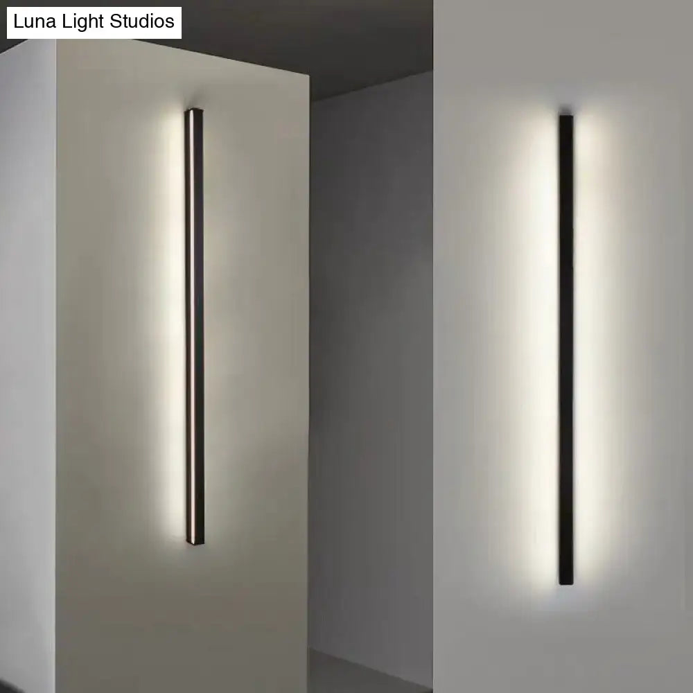 Modern black linear flush mount wall sconce with minimalist design and warm ambient hallway lighting