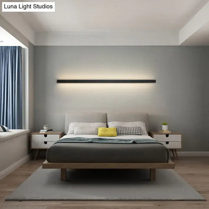 Modern black linear flush mount wall sconce with a sleek minimalist design for hallway lighting