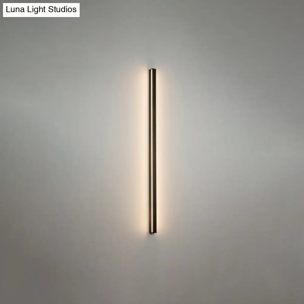A sleek modern black linear flush mount wall sconce with slim rectangular design and warm ambient glow for hallways