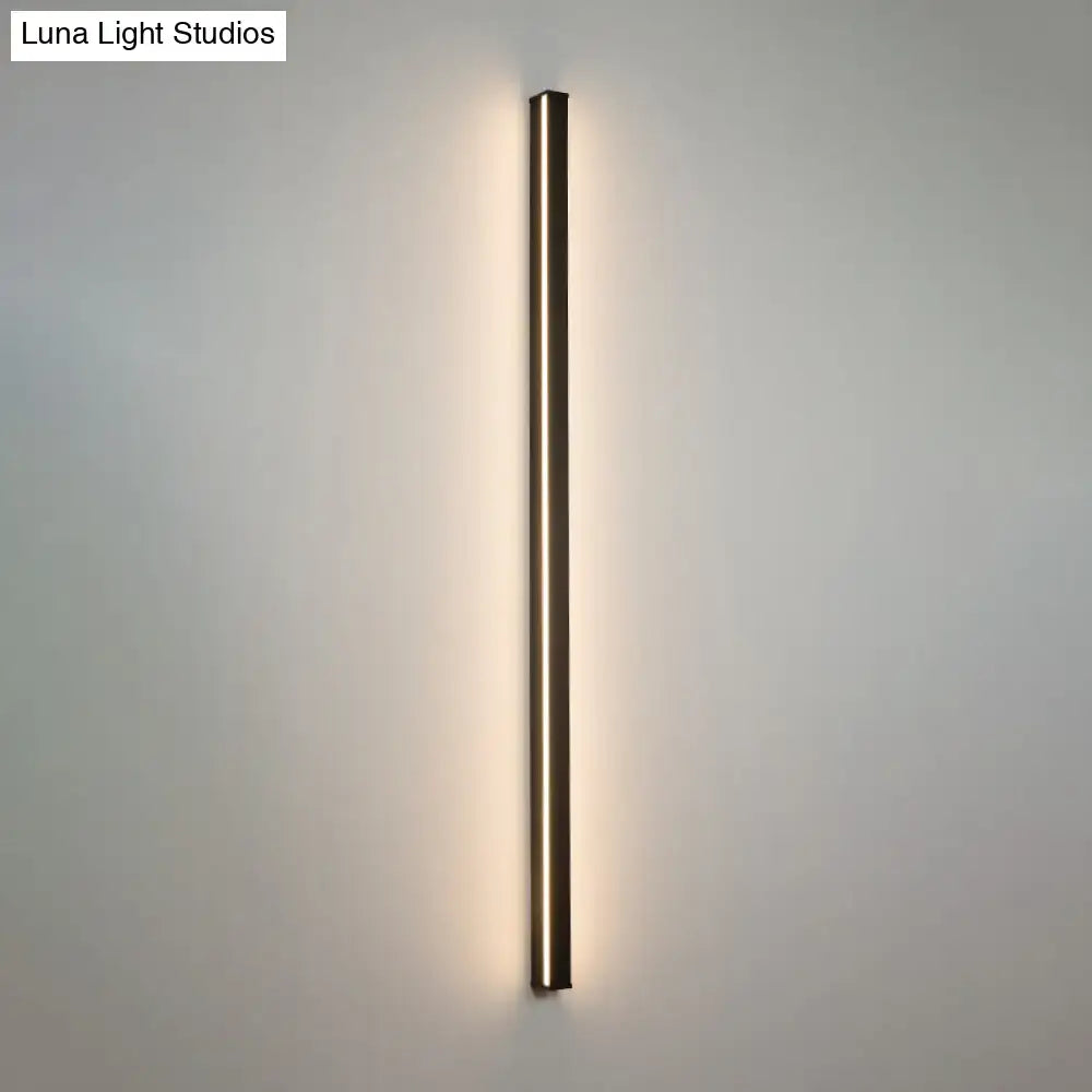 Modern black linear flush mount wall sconce with slim metallic frame and warm ambient glow for hallway lighting