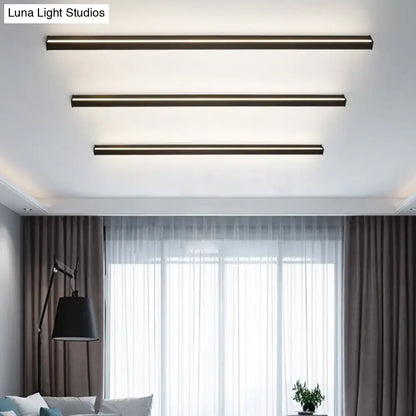 Three sleek modern black linear flush mount ceiling lights with brushed bronze finish for hallway lighting