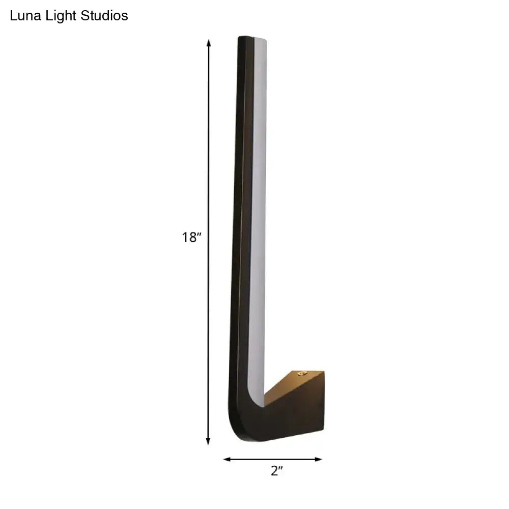 Modern black l-shaped wall sconce with brushed brass finish and integrated led light strip for direct wired electric use